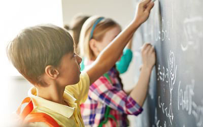 children at a chalkboard