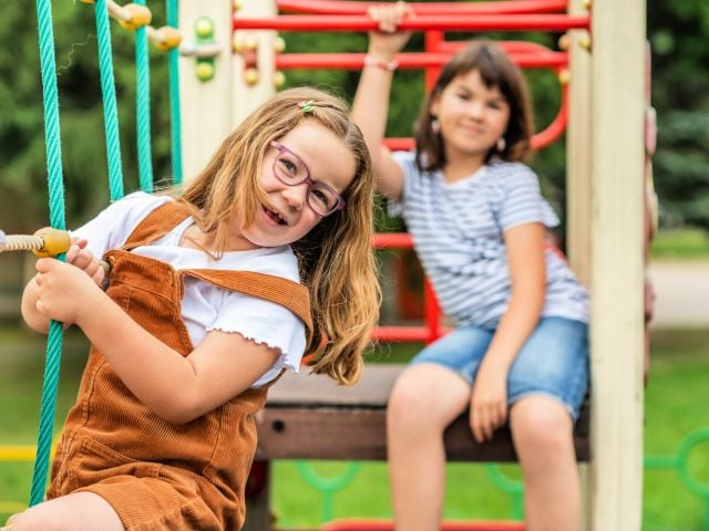 Little girls in playground. 