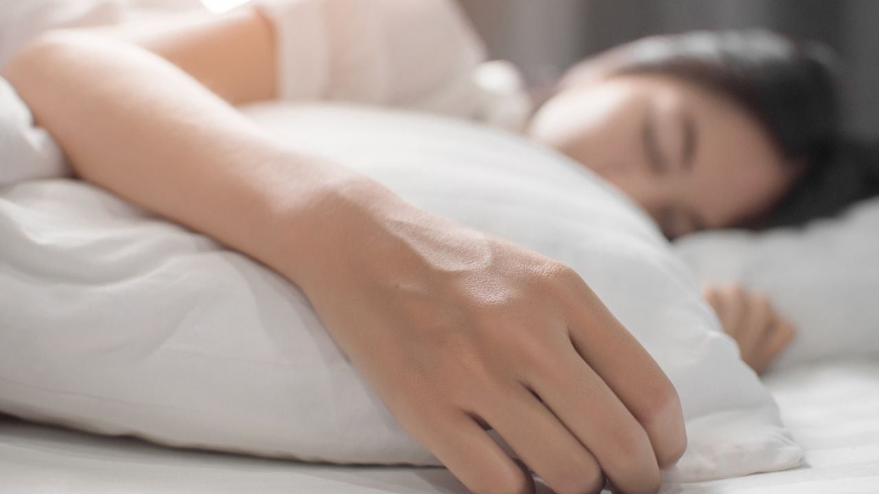 Woman sleeping on mattresses