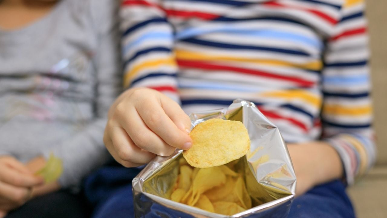 Children eating potato chips